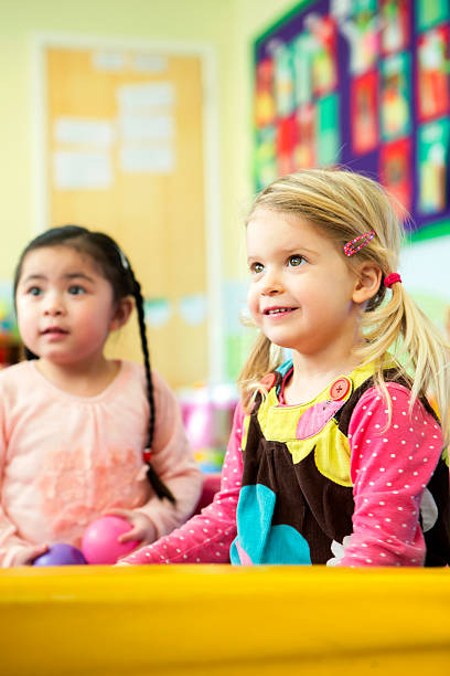istock Two little girls playing in a ball pool 468529816