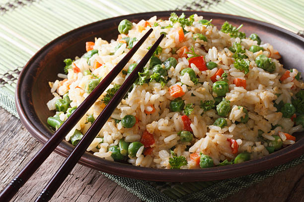 istock Asian fried rice with egg and vegetables closeup, Horizontal 468532822
