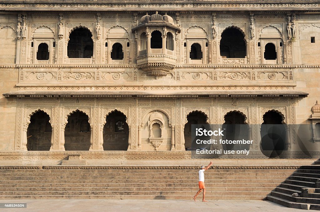 People walking in front of Maheshwar palace on India Maheshwar, India - 3 February 2015: People walking in front of Maheshwar palace on India 2015 Stock Photo