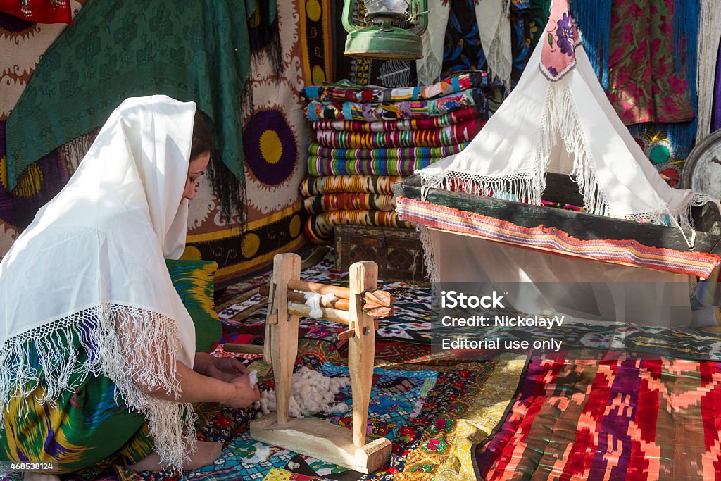 Traditional home lifestyle in Central Asia Khujand, Tajikistan, March 22, 2015: Reconstruction of retro traditional tajik home lifestyle in central park during the celebration of Nowruz holiday in Khujand town, Sughd province, Tajikistan 2015 Stock Photo