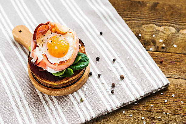 istock Baked egg in the ham basket 468538390