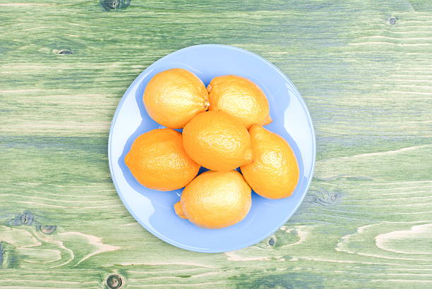 istock typical yellow lemon on a green chalkboard space for text 468538712