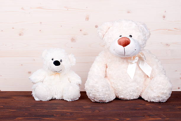istock cute teddy bear toy on the board top view 468538830