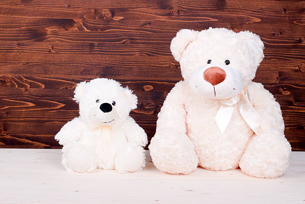 istock cute teddy bear toy on the board top view 468538866