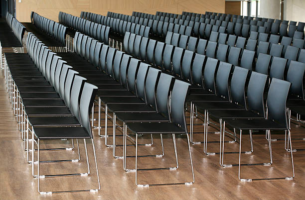 istock Rows of empty chairs prepared for an indoor event 468538924