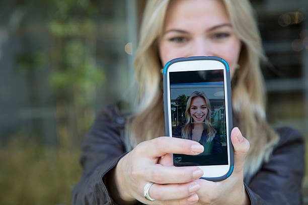 istock Pretty Blonde Smiling for a Selfie 468541628
