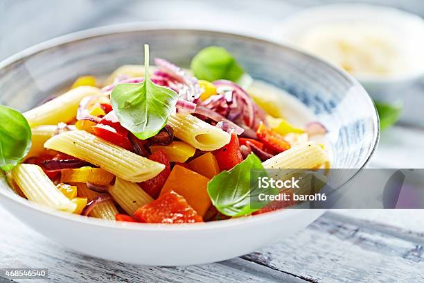 Penne Pasta With Peppers And Basil Stock Photo - Download Image Now - Penne, Spanish Onion, 2015