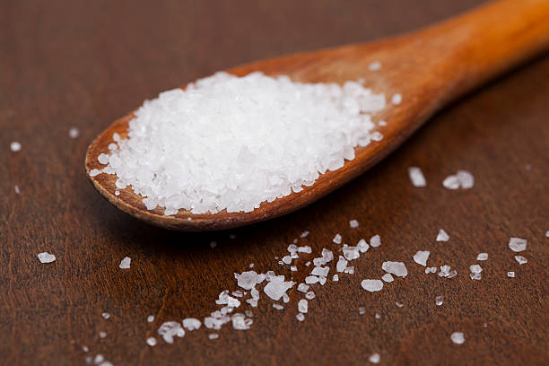 istock Ocean salt crystals on a wooden spoon 468547226