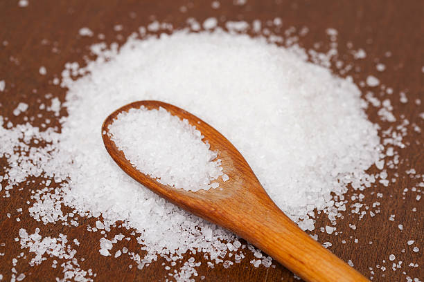 istock Ocean salt crystals on a wooden spoon 468547234