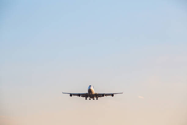 istock airplane flying in blue sky 468548234