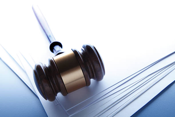 istock Gavel on a stack of blank pieces of paper 468548304