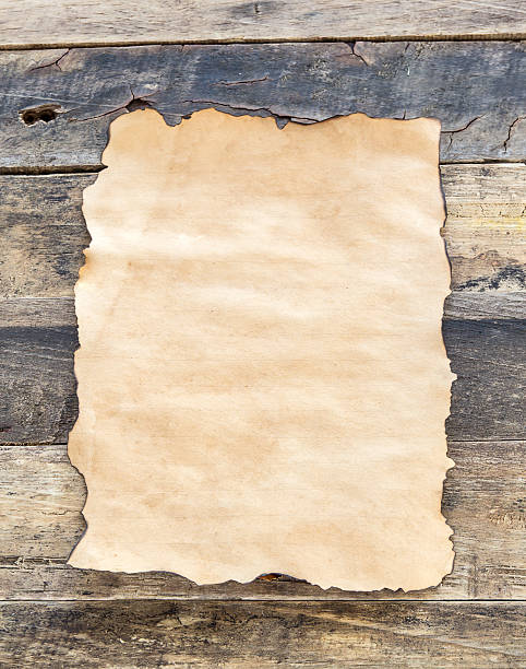 istock Close up old paper on wooden background 468550748