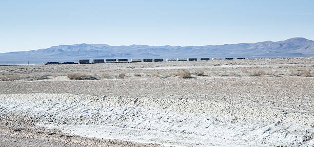 istock Train Roaring Across the Desert 468552030