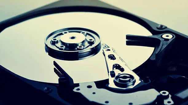 Close up of open computer hard disk drive (HDD)