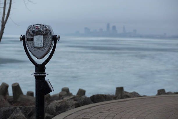 istock Binoculars towards large city. 468552620