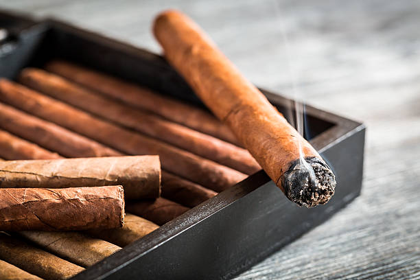 istock Burning cigar with smoke on old humidor 468552655