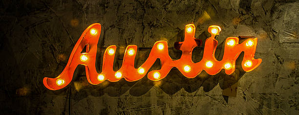 wide shot austin light up wall sign on textured wall