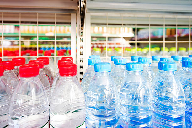 istock Many bottles of clean water with white lids 468553553