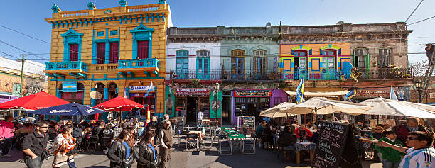 Caminito, La Boca, Buenos Aires Buenos Aires, Argentina - August 9, 2014: busy street with colourful houses and terraces near Caminito in La Boca;  caminito stock pictures, royalty-free photos & images