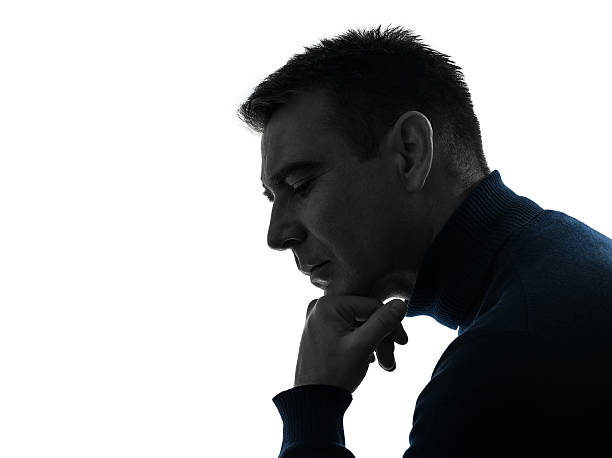 istock man serious thinking pensive silhouette portrait 468554260