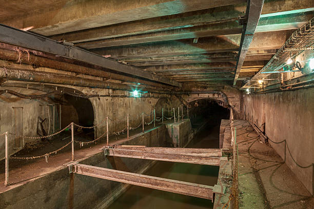 Paris Sewer Exploring the sewer tunnels underneath the streets of Paris, France. sluice photos stock pictures, royalty-free photos & images