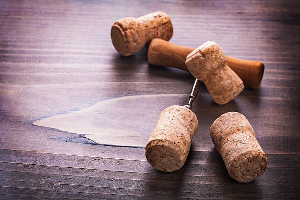 istock four corks and corkscrew on vintage wooden board alcohol concept 468557370