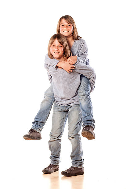 istock boy carries his twin brother 468557694