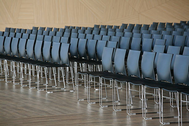 istock Rows of empty chairs prepared for an indoor event 468557740