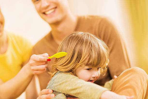 istock Little boy doesn't want to comb his hair. 468558338