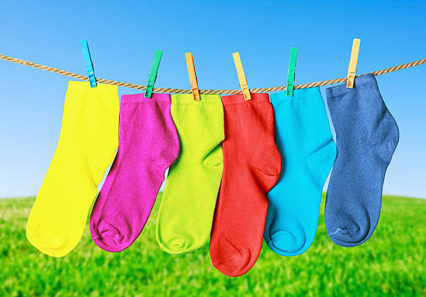 istock colorful socks hanging from a rope 468559778