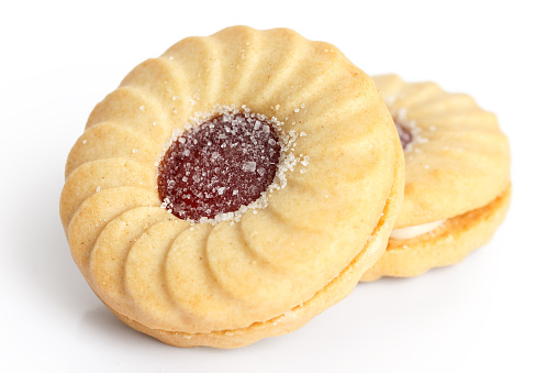 Strawberry jam ring biscuit on white.
