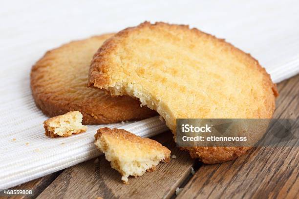 Two Butter Biscuits On Napkin And Wood Broken Stock Photo - Download Image Now - Cookie, French Culture, Butter