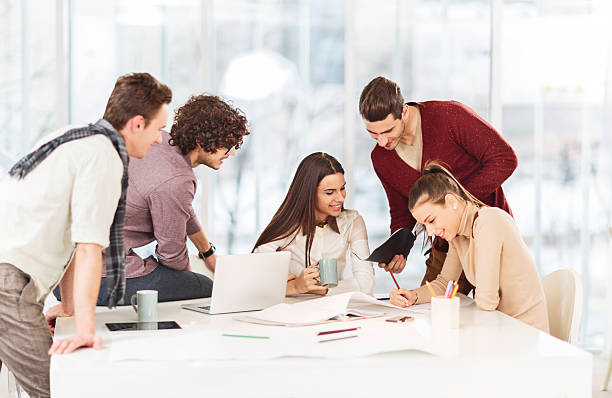 istock Happy start up team working in the office. 468560406