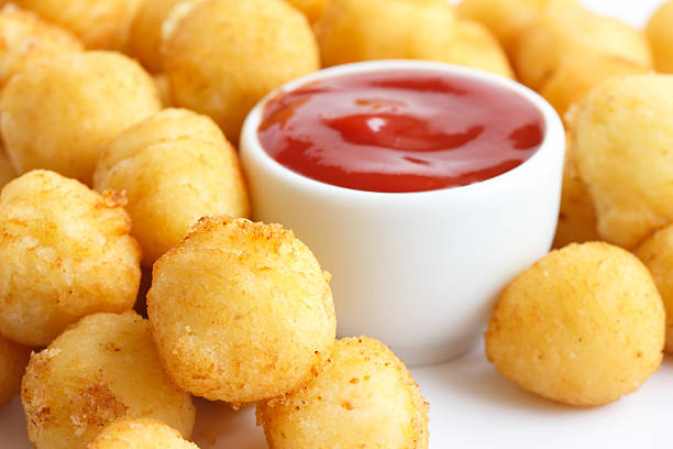 istock Bowl of fried small potato balls on white. 468560480