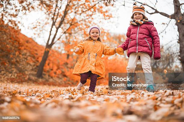 Happy Children In Autumn Park Stock Photo - Download Image Now - 2015, Autumn, Bonding