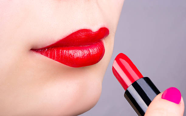 istock Female lips and lipstick 468563372