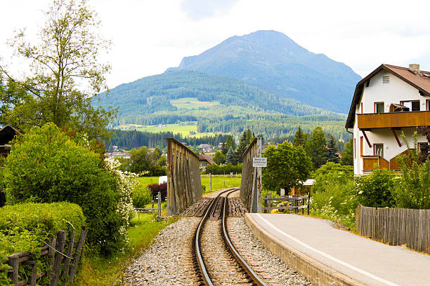 istock Railroad in alpine town 468563969