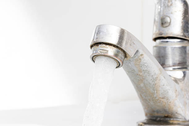 istock Water Flowing from Old Faucet 468564164