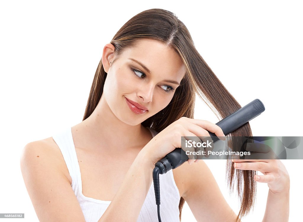 The straighter, the better Portrait of a beautiful young woman straightening her hair with a straightening ironhttp://195.154.178.81/DATA/i_collage/pi/shoots/782247.jpg Hair Straighteners Stock Photo