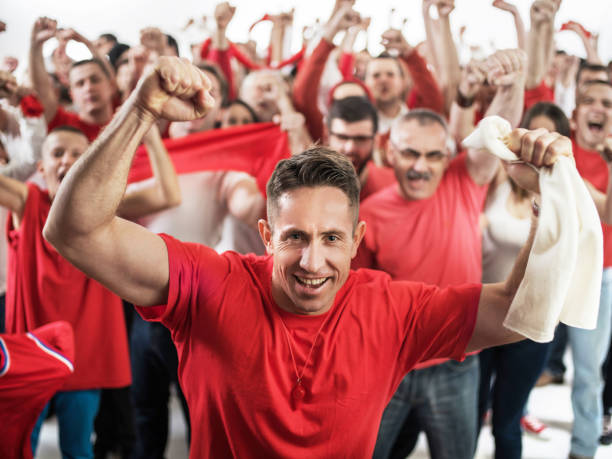 istock Cheerful man cheering and looking at camera. 468566630