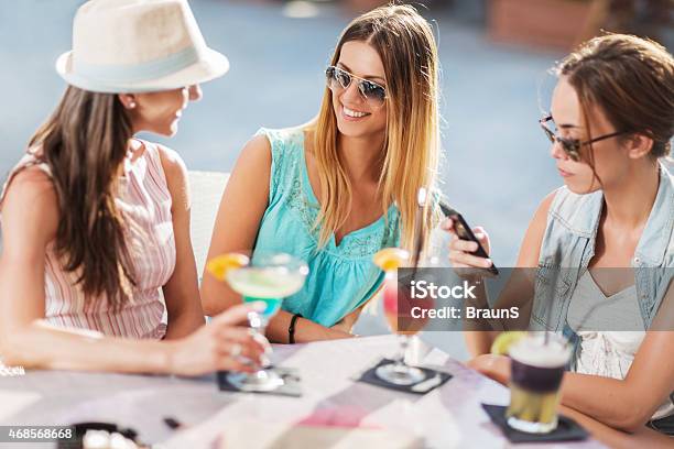 Happy Female Friends Enjoying A Day In Cafe And Talking Stock Photo - Download Image Now