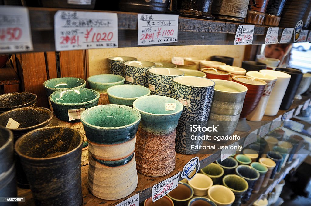 Japanese ceramic bowls for sale in Kappabashi store Tokyo, Japan - June 25, 2009: Japanese ceramic cups displayed at one shop in Kappabashi Dori, Taito Ward, Tokyo, Japan. Kappabashi is well known as a shopping street of restaurant and kitchen equipment. It is located between two major touristy areas, Ueno and Asakusa. Art And Craft Stock Photo