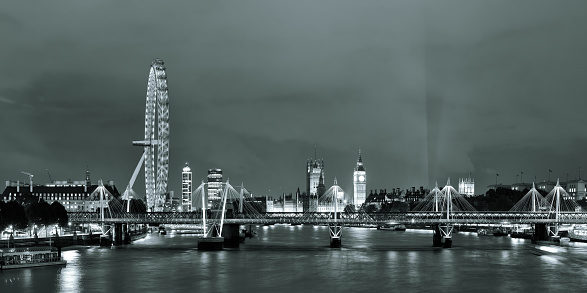 Thames River night with London urban architecture.