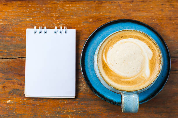 istock ceramic cup of hot coffee on wooden table. 468575834
