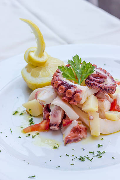 istock Appetizer of cuttlefish octopus and potatoes 468576182