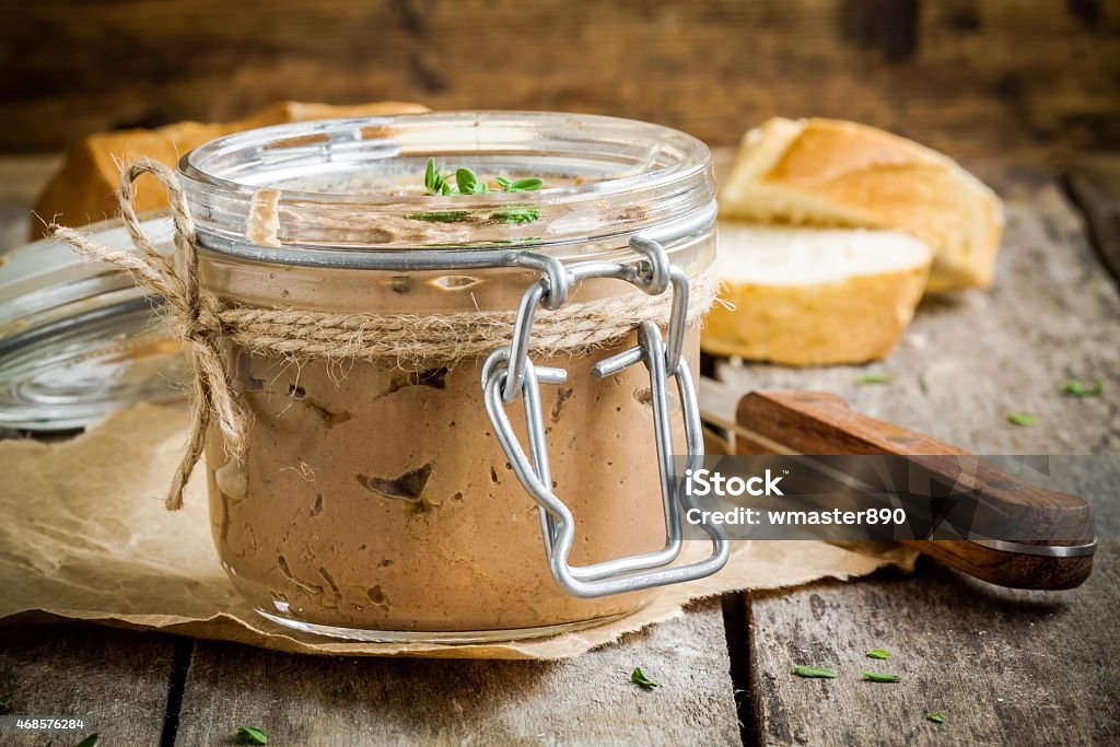 homemade chicken liver pate in the jar homemade chicken liver pate in the jar on a rustic wooden table 2015 Stock Photo