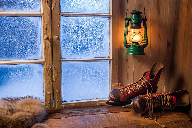istock Warm cottage in a winter evening 468578105