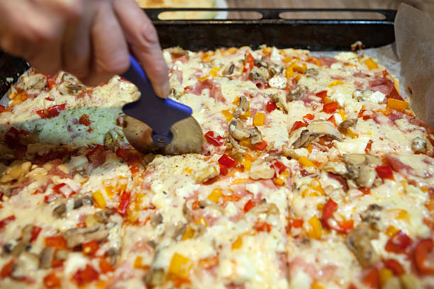 istock Cutting Homemade Pizza 468579314
