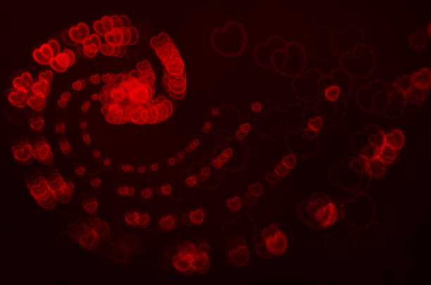 istock various red hearts against a black background 468579395