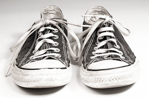 istock pair of black canvas sneakers on white background 468582094